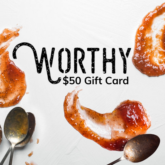spoons covered in jam and jam smears all around the spoons with writting in the center of the image that reads "Worthy 50 dollar gift card".